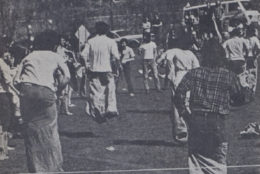 black and white old photo of potato bag race