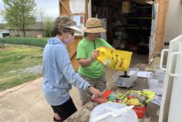 two women preparing soil for gardening project