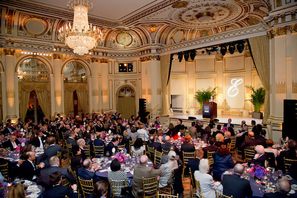 People sitting at tales in a banquet hall