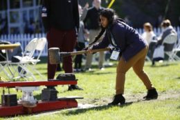 woman with large hammer playing carnival games