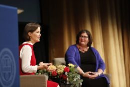 two woman on stage giving a talk