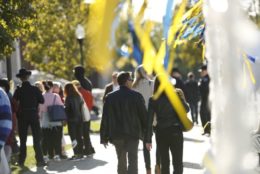 ourdoors in front of meliora village with a crowd on campus