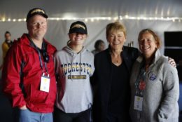 president mangelsdorf posing for photo with parents and daughter