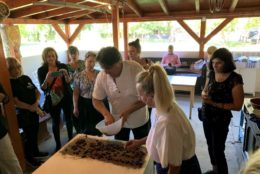 group watching a cooking demonstration