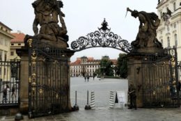 gateway to a plaza with brick road