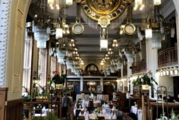 large dining room with set tables but no people