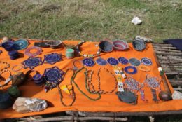 table with orange cloth covered in jewelry from tanzania