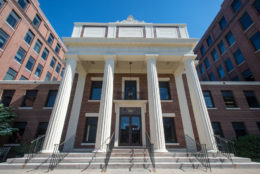 brick building with four pillars - entrance of SMD/URMC