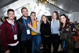 group of young alumni posing for photo