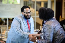 man and woman giving each other a handshake