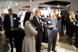 group of people at an event looking on to a performance