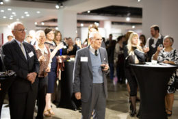 group of people at an event looking on to a performance