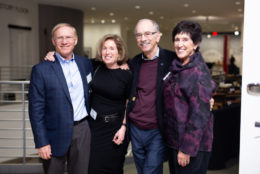 two man and two women posing for photo