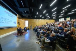 lecture hall full of attendees during talk at Meliora Weekend