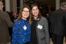 two women smiling for photo