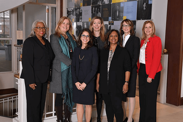 Group of women posing and smiling for camera