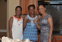 three women smiling for photo