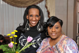 two women smiling for the camera