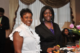 two women smiling for photo