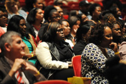 auditorium full of people attending an event