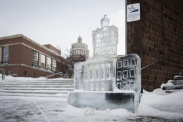 ice sculpture of rush rhees library tower on ground with the tower in background