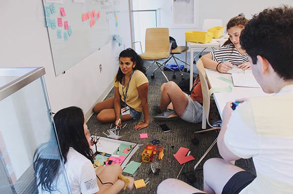 People in a classroom working on a project