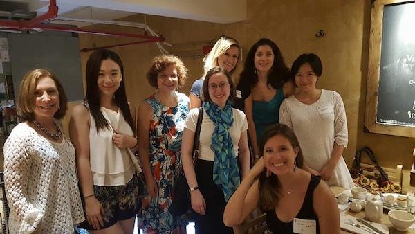 Group of women smiling and posing for camera