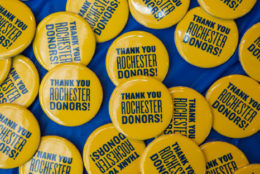 table full of thank you rochester donors buttons