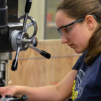 Student using a machine