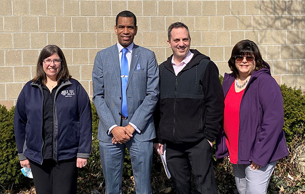Margaret Schweizer, Director of Meals on Wheels; Malik Evans ’02, Mayor of Rochester; Andy LaManna, Advisory Committee member; and Julie Cunningham, Volunteer Manager