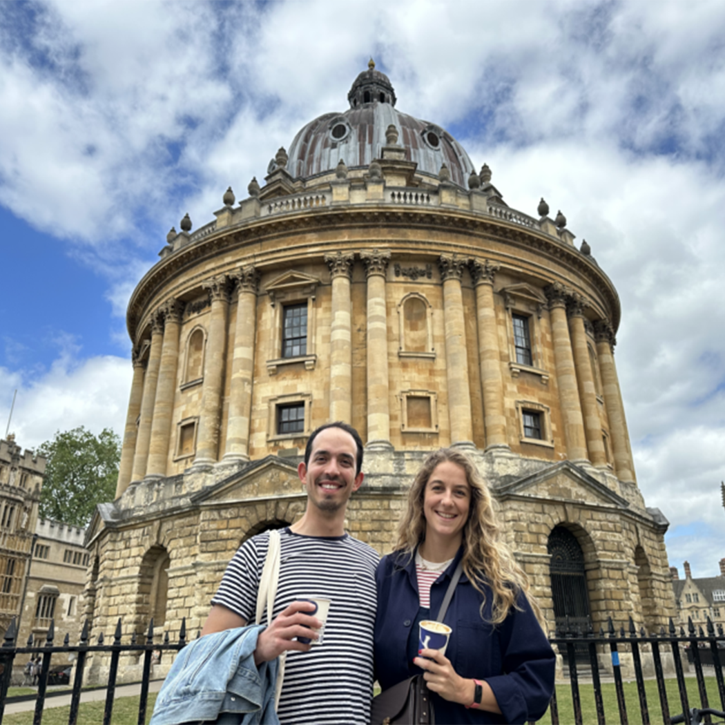 United Kingdom Network Leader Pedro Vallejo Ramirez ’16 with partner in front of a buidling