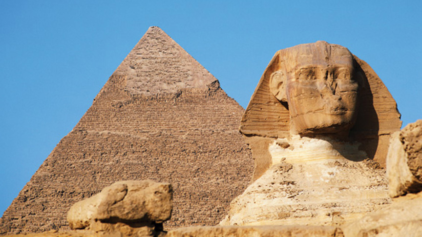 Pharoah structure with great pyramid in background