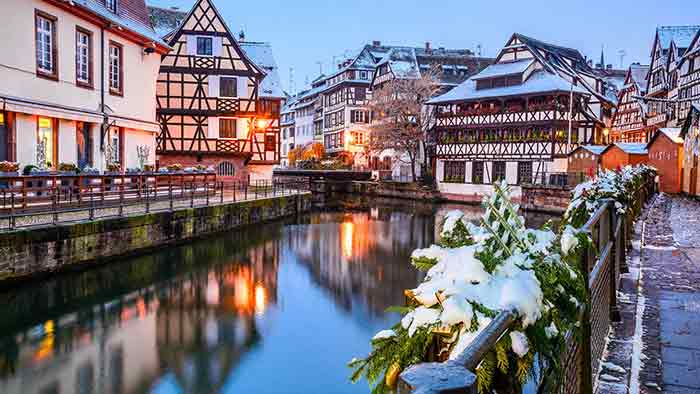 European tutor style town along a water during winter