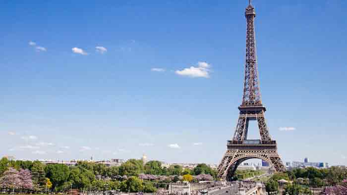 Eiffel tower against a blue sky