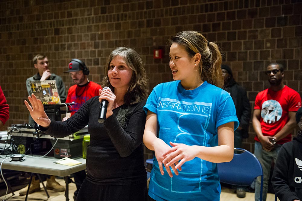 women talk on mic before show