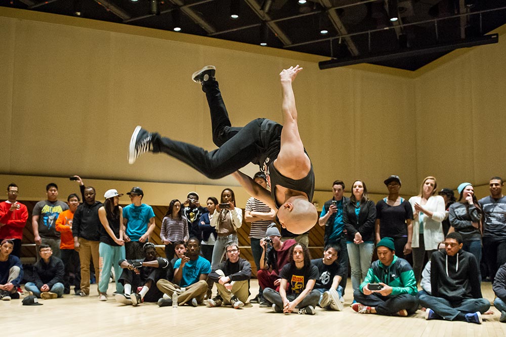 guy goes airborne while breakdancing.