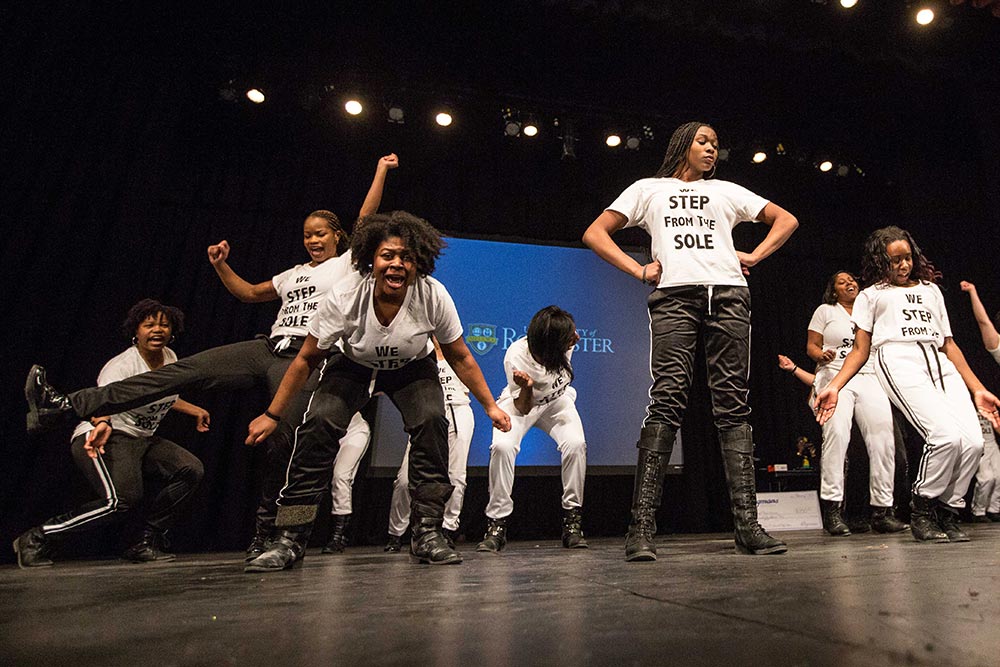 women dance on stage