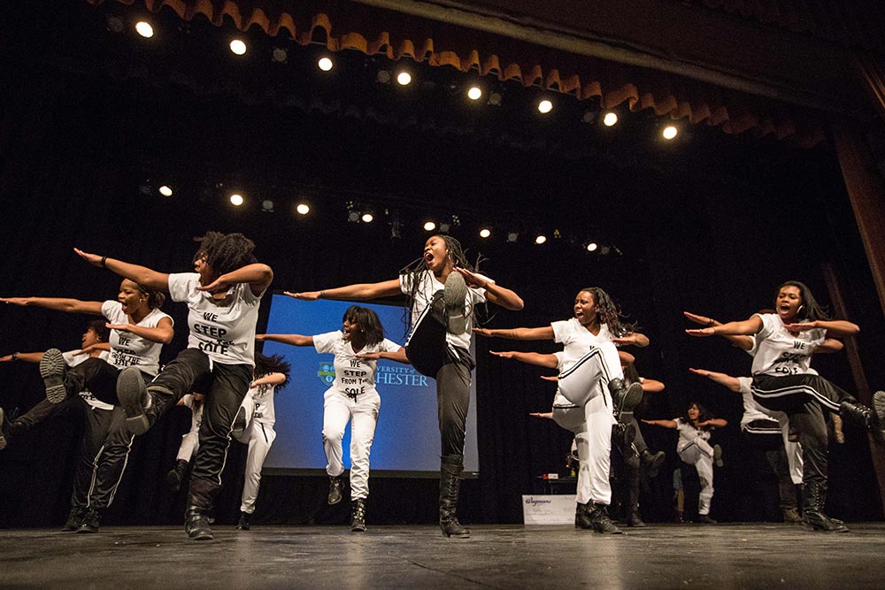women dance on stage