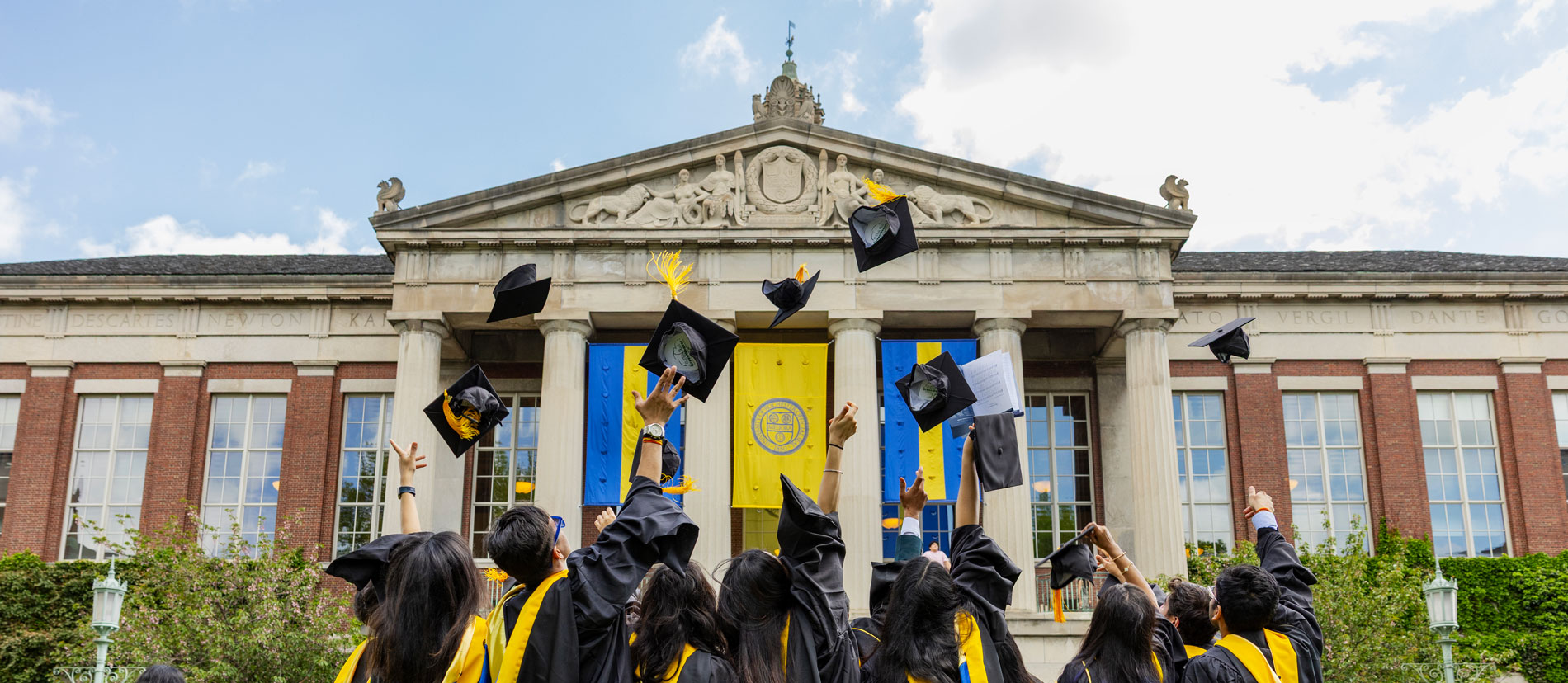 Graduation cap adorned with flowers and a tassel, celebrating University of Rochester Commencement Weekend.