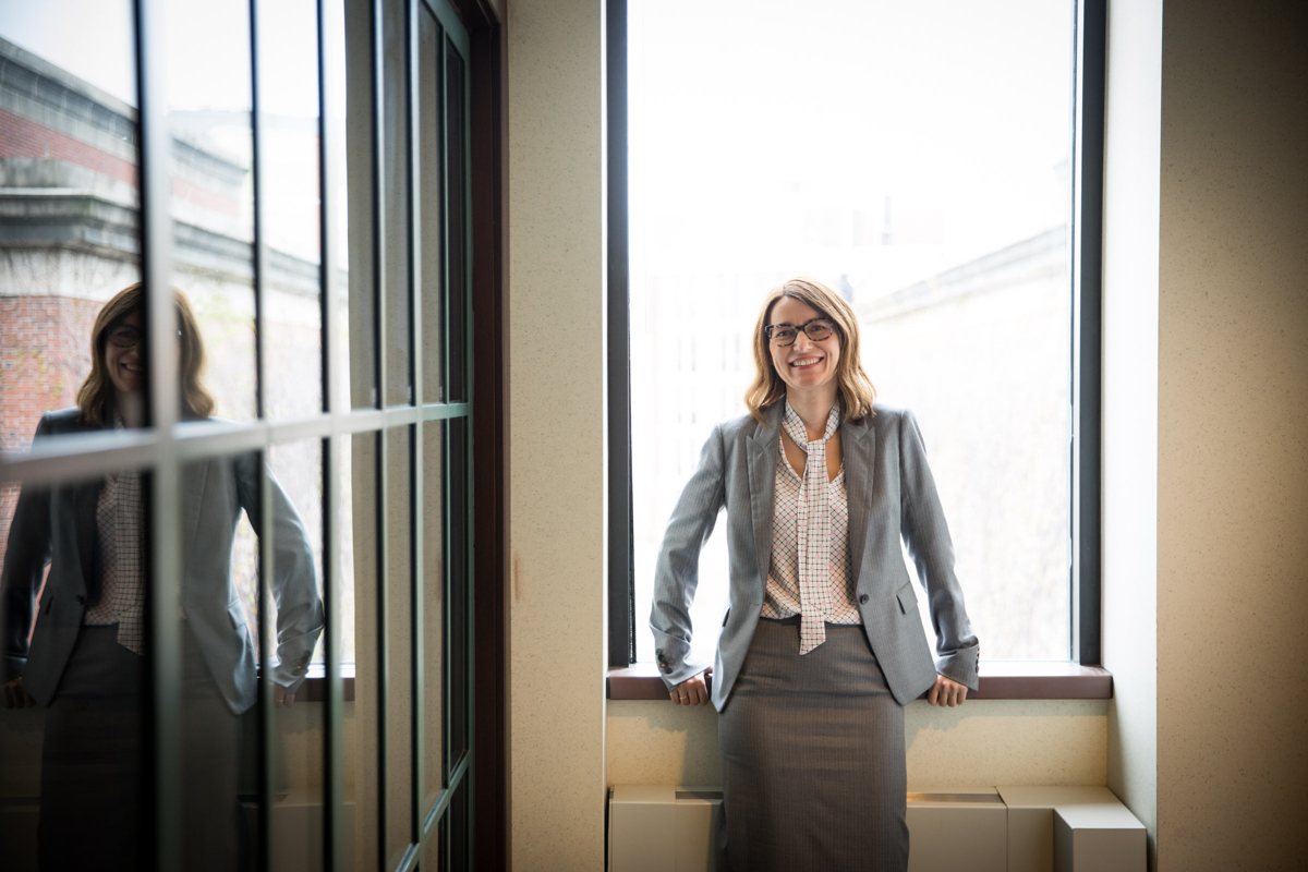 Female standing in front of window at University of Rochester