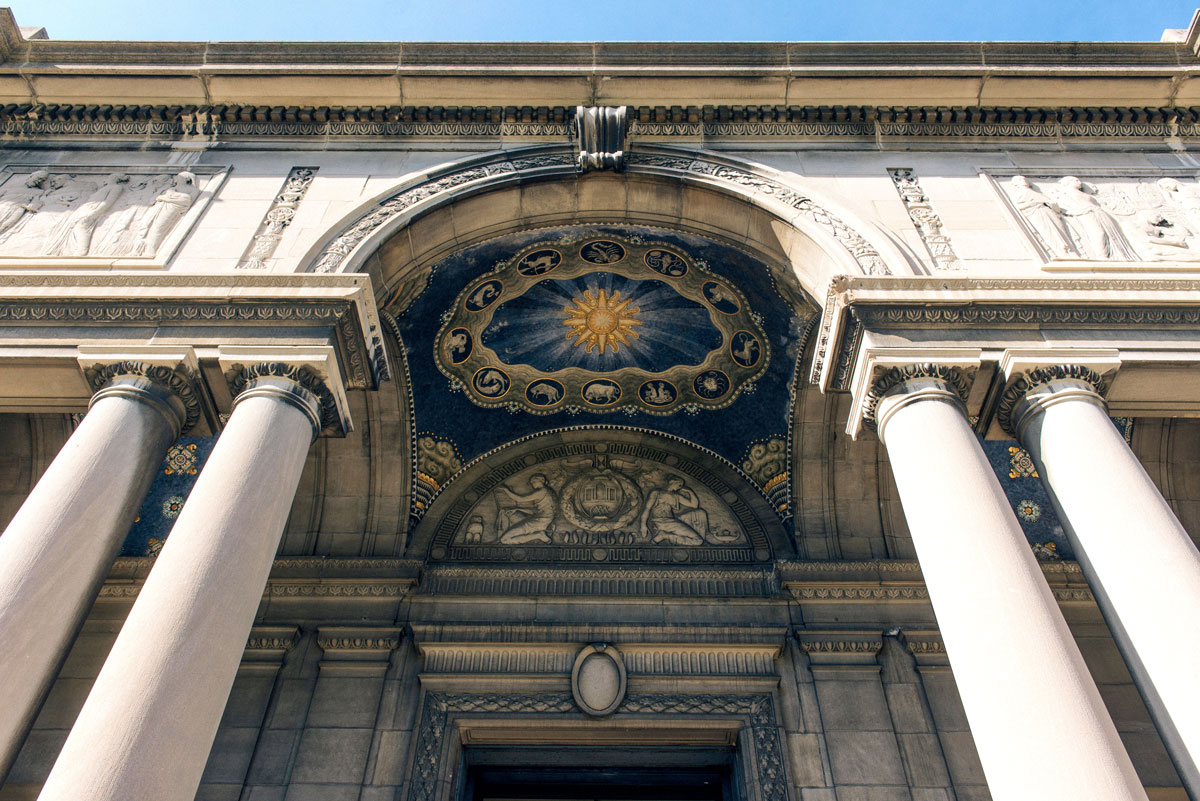 A grand building with columns, located at the University of Rochester's Memorial Art Gallery, showcasing classical architecture.
