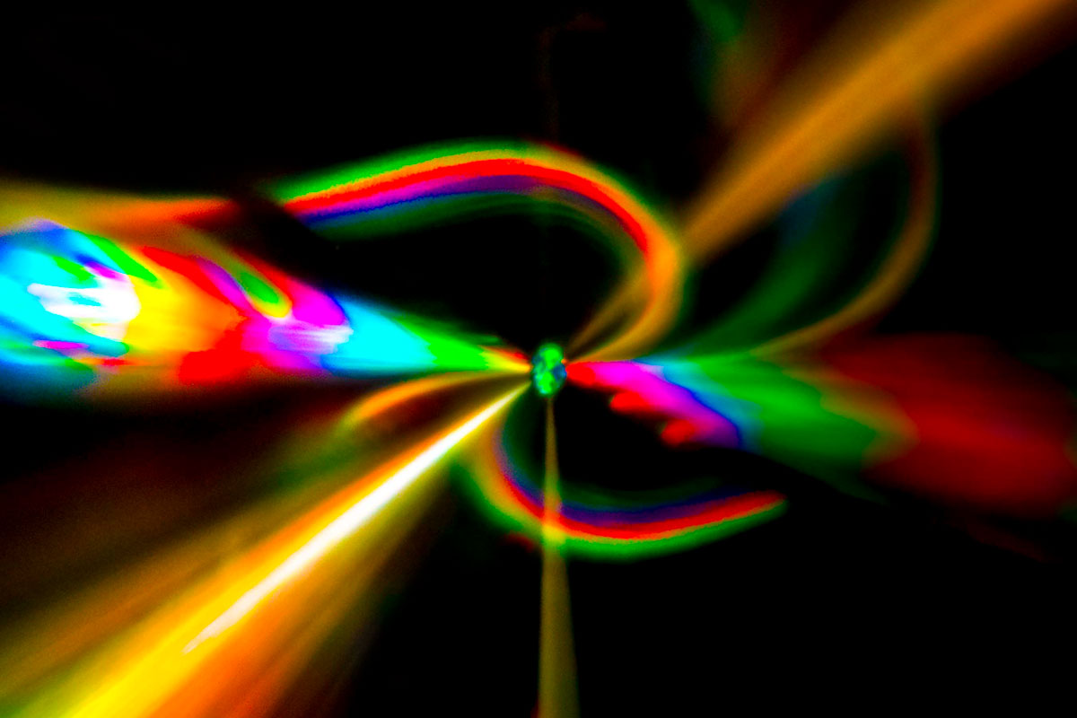 A vibrant light illuminates the darkness, showcasing research from the University of Rochester.
