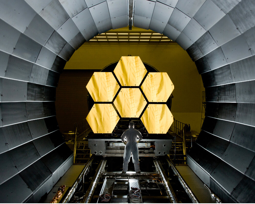 Laser researcher standing inside Omega laser housing at University of Rochester LLE