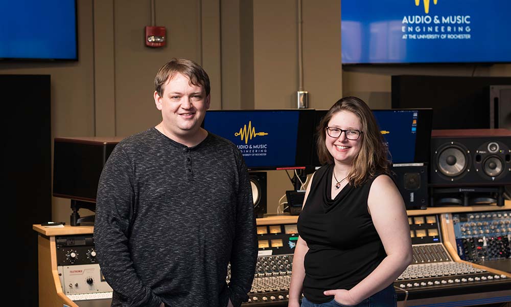 Grace Stensland and Rob McIntyre in a recording studio representing the summer internship she completed with him.