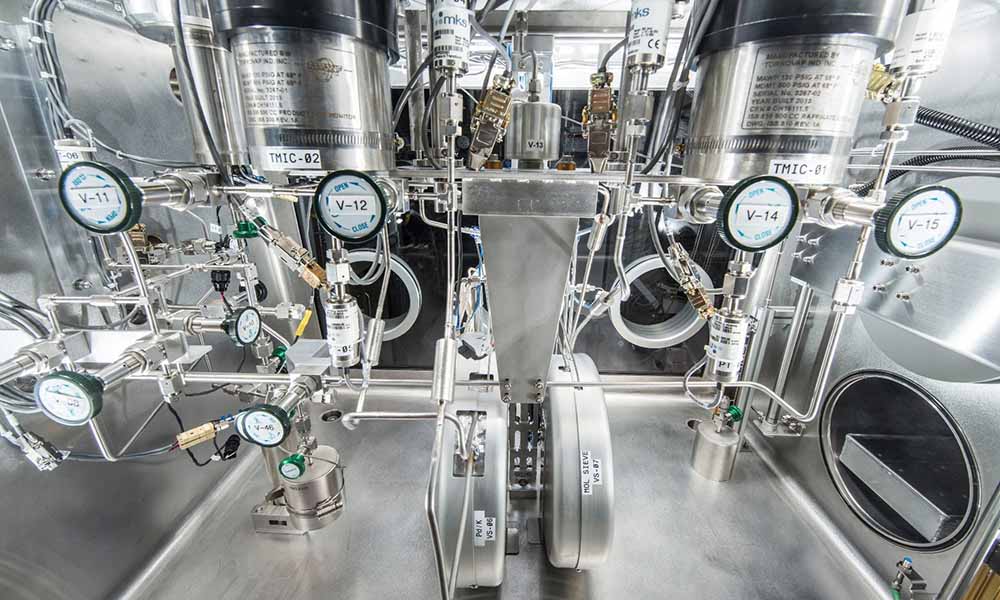 Hydrogen isotope separator system includes a series of silver pipes and valves.