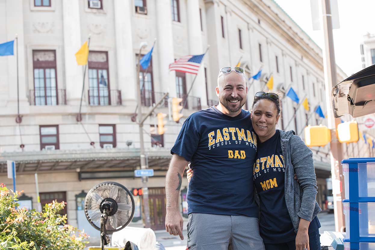 two parents wearing t-shirts that read EASTMAN MOM and EASTMAN DAD