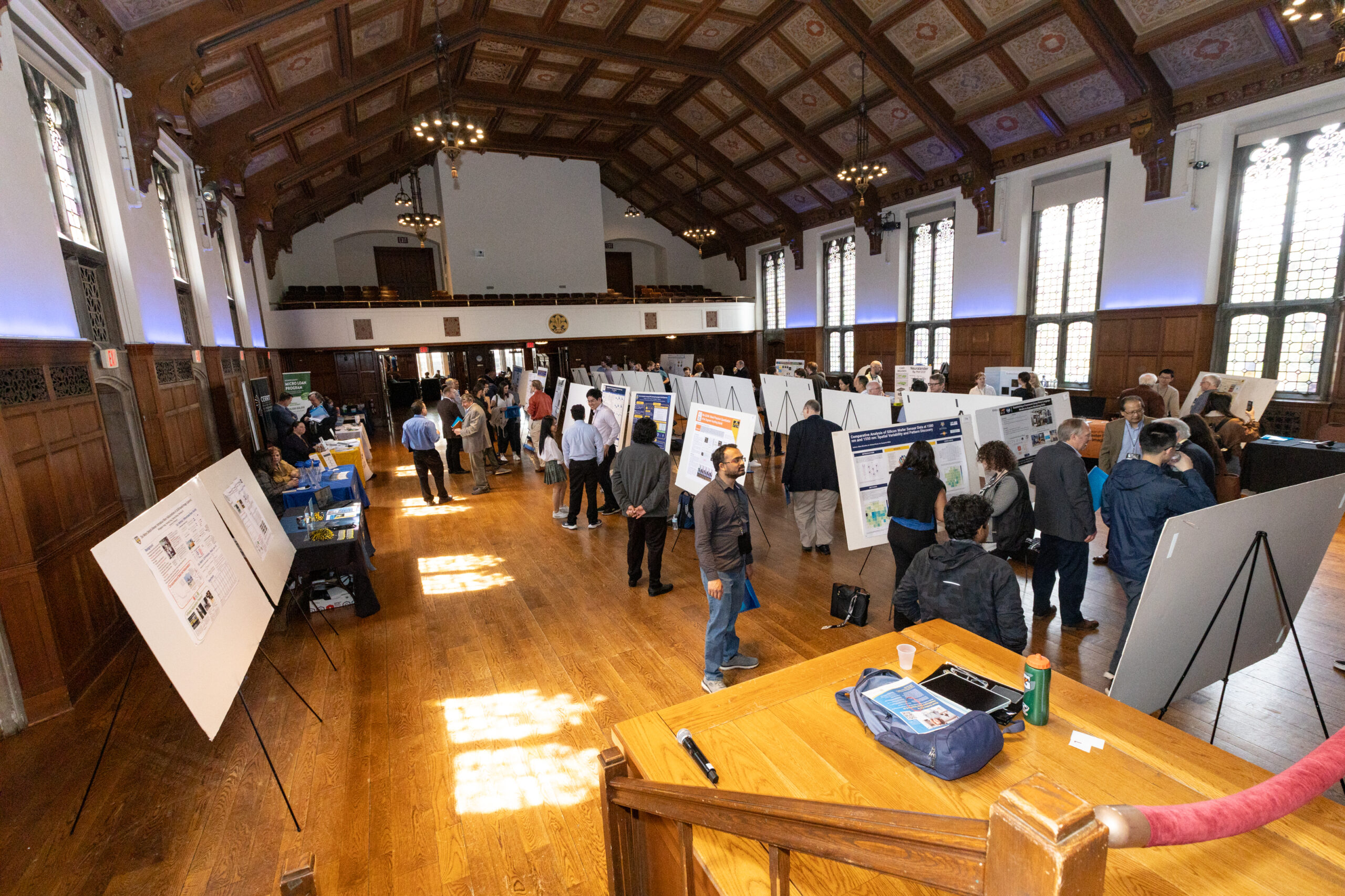 Attendees at the 2025 showcase view posters during the networking session