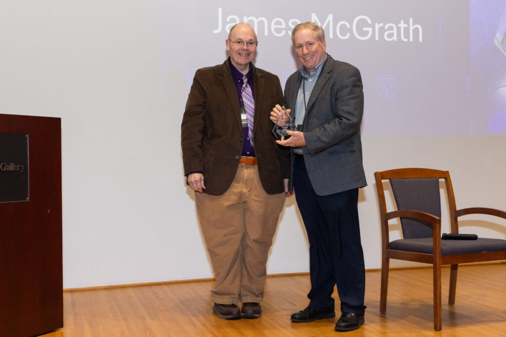 Mark Bocko posing with James McGrath who is holding his CEIS Partner Award.