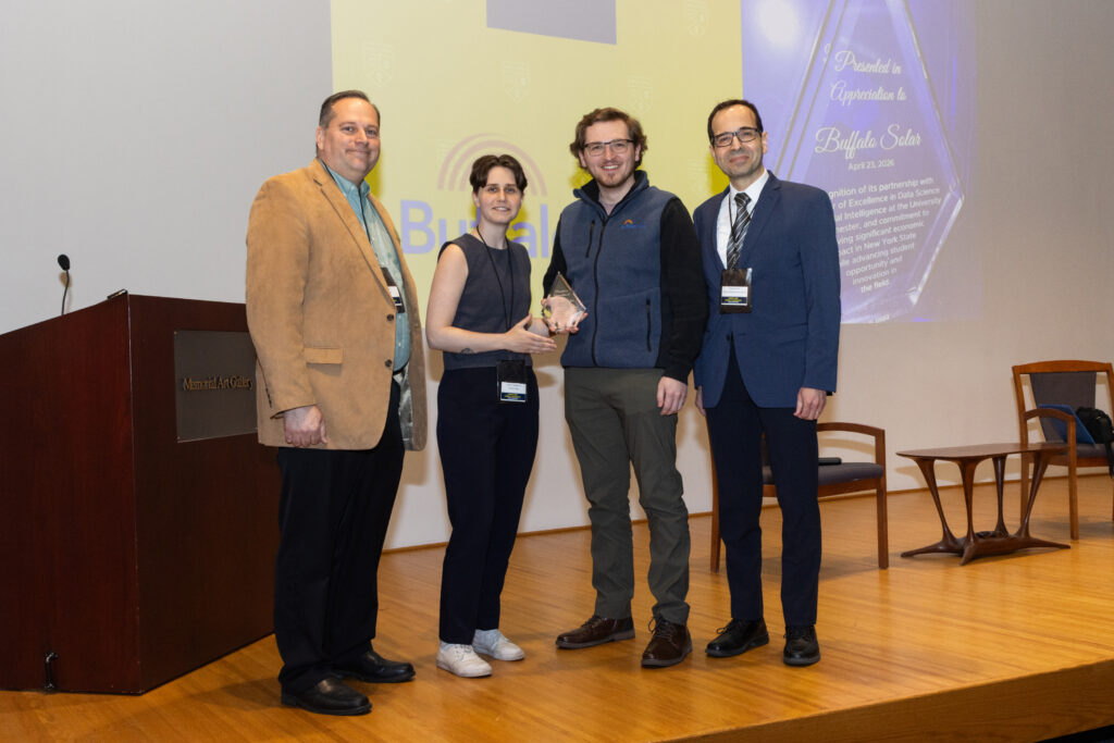 Nick Koziol, Alyssa Sengbusch, Eric Groff, and Mujdat Cetin pose for a photo together for the presentation of the CoE-DSAI Partnership Award to Buffalo Solar.