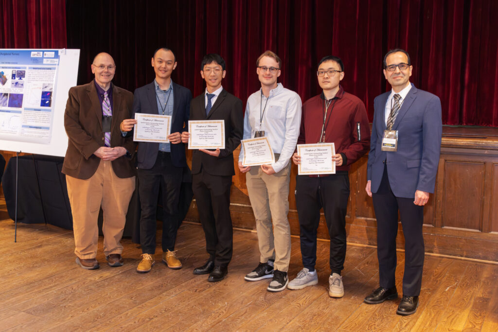 The 1st, 2nd, and 3rd place winners of the Poster Award session pose between Mark Bock and Mujdat Cetin